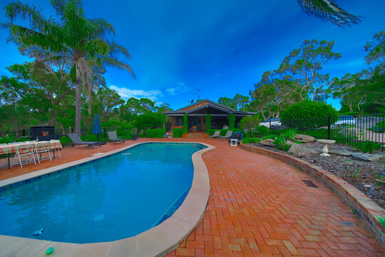 Residential house in Dural a country suburb in Sydney NSW Australia with lush green trees and grass 