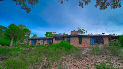 Fototapeta premium Residential house in Dural a country suburb in Sydney NSW Australia with lush green trees and grass 