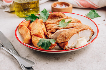 Homemade breaded chicken stuffed with cheese and potatoes