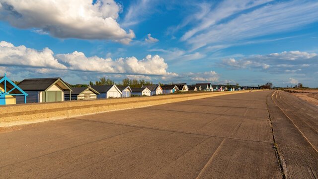 Clouds over the Beach Huts at the North Beach in Heacham, Norfolk, England, UK
