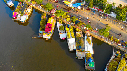 Aerial view of Ben Binh Dong (Binh Dong harbour) in lunar new year ( Tet Festical in Vietnam) with flower boats along side the river.