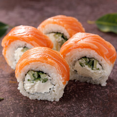 Philadelphia roll sushi on textured background still life. Restaurant concept. Close-up. Square.