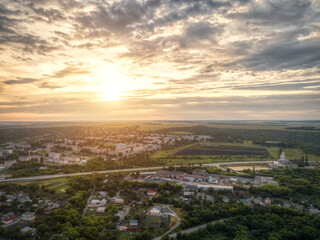 sunset over small town aerial view