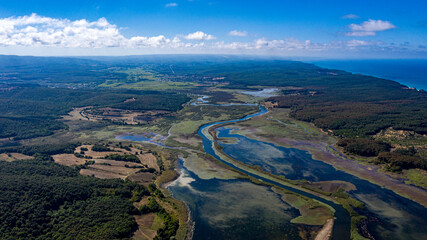 A panoramic shot of a lake near a path filled with forest from Durugol Turkey.