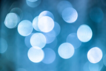 Defocused abstract blue and white Christmas background. Christmas large bokeh. Sky bokeh