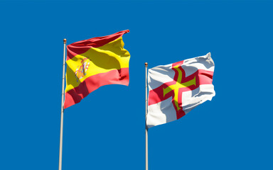 Flags of Guernsey and Spain.