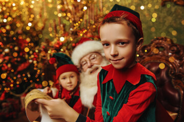Fototapeta na wymiar kids elves with santa