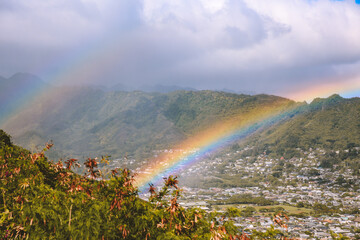 Rainbow over Manoa valley, Tantalus lookout, Honolulu, Oahu, Hawaii. A rainbow is an optical phenomenon that can occur under certain meteorological conditions. - 401920393