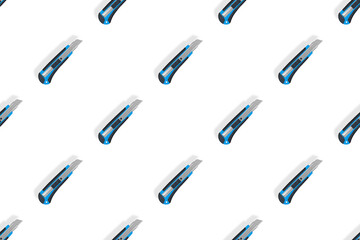 Stationery knives seamless pattern on a white background.