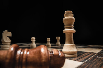 Chess game with chess pieces against black background