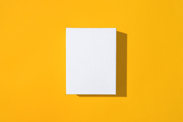 White empty small box mockup on yellow background top view.