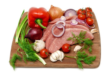 vegetables, herbs and raw meat on a white background