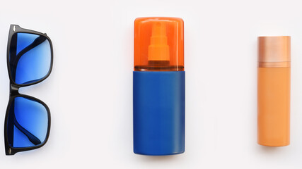 Summer concept. Relax on the beach, sunblock and sunglasses