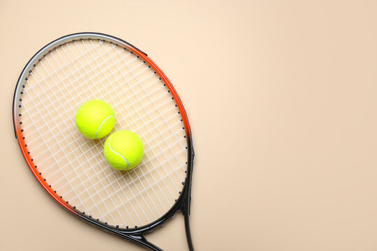 Tennis racket with balls on light background © Pixel-Shot