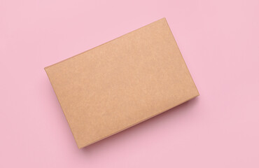 Blank cardboard box on color background