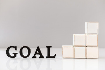 Composition with word GOAL on light background