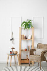 Interior of modern room with shelf unit and armchair