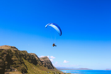 Fototapeta na wymiar Paragliding at Makapuu point, Oahu, Hawaii 