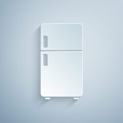 Paper cut Refrigerator icon isolated on grey background. Fridge freezer refrigerator. Household tech and appliances. Paper art style. Vector.