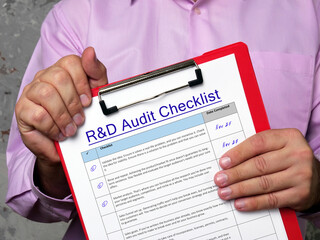 Business concept about Research Development R&D Audit Checklist with sign on the sheet.