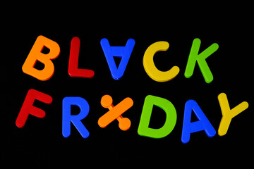 Black friday. Multi colored letters against black background