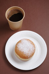 Takeaway coffee cup and donut