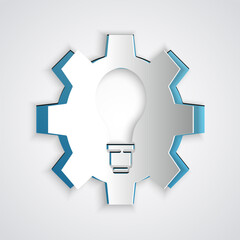 Paper cut Light bulb and gear icon isolated on grey background. Innovation concept. Business idea. Paper art style. Vector.