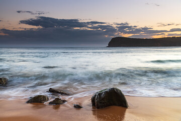 Fototapeta na wymiar Sunset, rocks and the sea