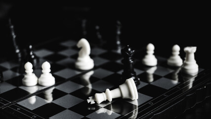 chess board black and white pawns and chess pieces intelligence game queen's gambit checkmate