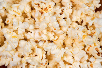salted popcorn, food texture background. Fastfood popular during a movie in a cinema