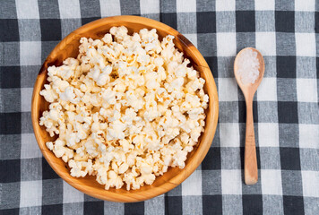 movie theater popcorn in a bowl. classical popcorn with sea salt. flat lay
