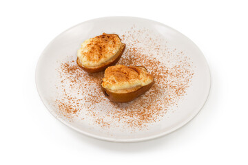 Pears baked with ricotta cheese, sprinkled with cinnamon powder
