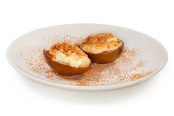 Baked pear with ricotta cheese and cinnamon powder close-up