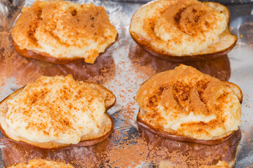 Pears baked with ricotta cheese, honey and cinnamon close-up