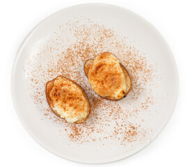Baked pear with ricotta cheese and cinnamon powder, top view