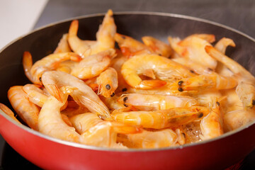 red shrimps with heads on the pain close-up in selective focus. sea food