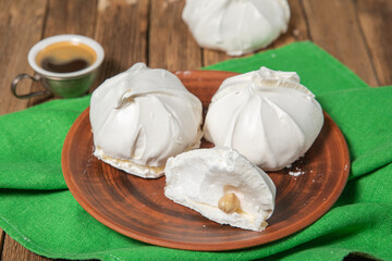 French vanilla meringue cookies on wooden background