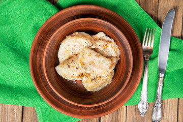 Dumplings, filled with beef meat and served with fried onion. Varenyky, vareniki, pierogi, pyrohy. Dumplings with filling
