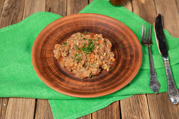 Eggplant caviar in the rustic bowl closeup