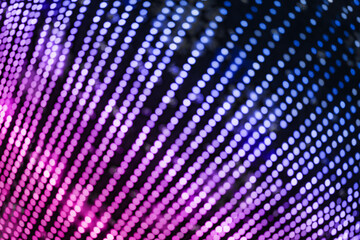 Colorful background with natural bokeh texture and defocused sparkling lights pattern. Blue and pink violet blur background with twinkling lights. Festive multi-colored lilac overlay colors banner