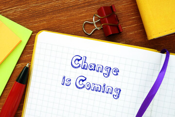 Business concept meaning Change is Coming with sign on the piece of paper.