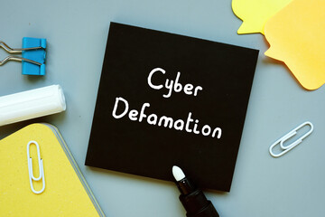 Financial concept about Cyber Defamation with sign on the sheet.
