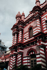 A view on Jami-Ul-Alfar Mosque in Colombo, Sri Lanka on a gloomy sky background
