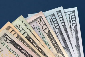 Many american dollar banknotes. Symbolic photo for debt and wealth.