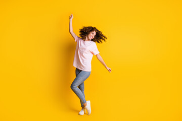 Photo portrait full length of woman dancing isolated on vivid yellow colored background