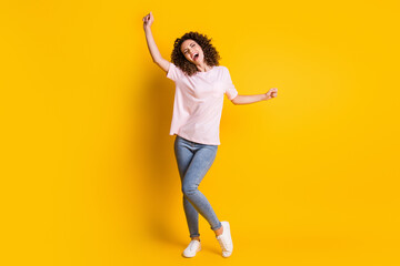 Photo portrait full body view of screaming woman dancing isolated on vivid yellow colored background