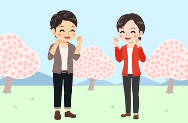 Young men and women in front of Sakura in spring