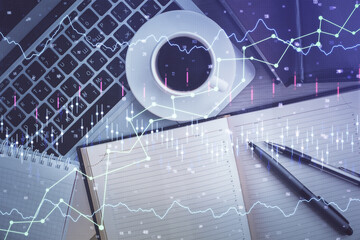 Stock market chart and top view computer on the table background. Double exposure. Concept of financial analysis.