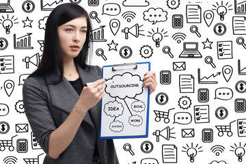 Business, technology, internet and network concept. Young businessman thinks over the steps for successful growth: Outsourcing