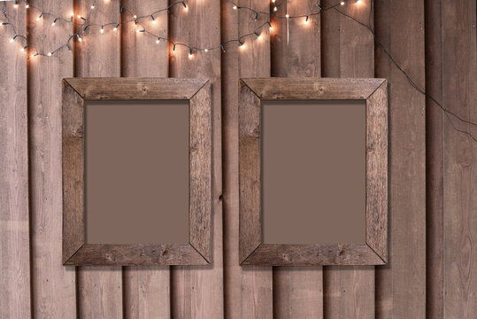 Set of two old wooden photo frame on wood board wall